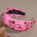 Detail of pink knotted headband with candy prints and sparkling rhinestone embellishments - Rhinestone Pink