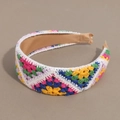 Detail of colorful knitted floral pattern on headband with smooth khaki inner lining - Flat Deep Colorful