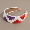 Detail of colorful crochet floral headband with vibrant knitted patterns on a soft white base - Flat Rainbow Multicolored
