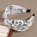 Floral twist headband in cream and black fabric with vintage botanical print details - Knotted Floral White