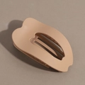Detail of matte pink hollow heart hair claw clip with smooth curved ergonomic design - Khaki