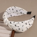 Detail of wide knotted floral headband with black butterfly print on cream fabric - Knotted Butterfly White
