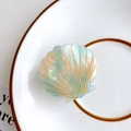 Medium seashell hair claw in pearlescent gradient mint green and pink orange tones - Lake Blue