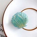 Elegant medium blue shell hair claw clip in acetate material with gold line detail - Teal Blue
