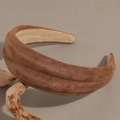 Brown wide suede headband displayed on a natural wooden branch with a minimalist look - Brown