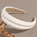Detail showing plush suede texture and thick padded design of the white headband - Off White