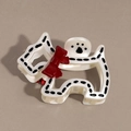 Detail eines hundeförmigen Haarklammer mit schwarzen Punkten und einer roten Schleife - Schwarzer Polka Dot