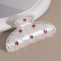 Détail de la pince à cheveux blanche élégante avec strass et pierres précieuses en cœur - Diamant Cœur Blanc