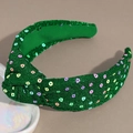 Detail of green sequin headband featuring a cross knot design and festive colorful glitters - Small Flower Green