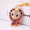 Portachiavi leone carino con strass bianchi e viola e decorazione corona dorata - Viola