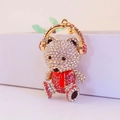 Cute teddy bear keychain with pink rhinestones and gold headphones accessory - Pink