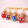 Colorful rhinestone ladybug keychains in four vibrant colors with gold metal hooks - Random Color