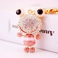 Goldener Frosch-Schlüsselanhänger mit funkelnden weißen und rosa Strasssteinen und großen Augen - Hellrosa
