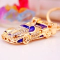 Golden sports car keychain with white rhinestones and blue enamel racing car charm - Blue