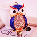 Creative crystal owl keychain featuring blue enamel wings and sparkling diamond rhinestones - Blue