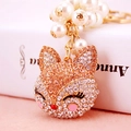 Elegant fox head keychain with champagne rhinestones and white imitation pearls - Champagne