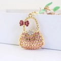 Llavero de bolso rosa con brillantes de diamantes y un lazo de cristal de metal dorado - Rosa