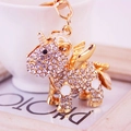 Funkelnder kristallbesetzter goldener Einhorn-Schlüsselanhänger mit weißem Emaille-Detail - Weiß