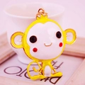 Cute cartoon monkey keychain with yellow enamel finish and sparkling rhinestone eyes - Yellow