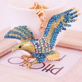 Portachiavi auto aquila creativa con strass blu e smalto verde su lega dorata - Blu
