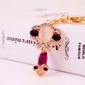 Chinese Ruyi style keychain featuring opal and purple rhinestones on a gold metal link - Key Style / Purple