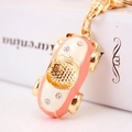 Pink and white enamel car keychain with sparkling rhinestones and gold alloy lobster clasp - Peach