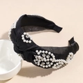 Detail of knotted black satin headband featuring embedded pearls and sparkling rhinestones - Black