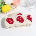 Detailed view of hand-knitted hair claw clip with strawberry patterns and clear grip teeth - Strawberry Cake Style