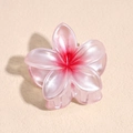 Detailed view of pink floral hair claw with pearlescent finish and gradient petal center - 4cm Red