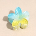 Macro view of gradient blue plumeria hair claw clip with glossy acrylic finish - 4cm / Lily Blue Yellow