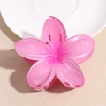 Detail view of pink plumeria flower hair claw clip made of semi-transparent resin - Rose Red