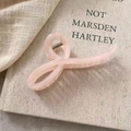 Elegant semi-transparent pale pink hair claw clip with a stylish cross design - Pink