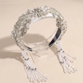 Detail showing the intricate crystal beads and long tassels on the wide baroque headband - White