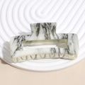 Detail of large acetate hair claw clip featuring black and white marble ink texture - Grey Ink Marble