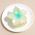 Macro detail of gradient green pearl finish flower hair claw clip with multi-tooth grip - Yellow-Green