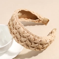 Detail showing the thick beige hand-woven fabric texture of this vintage padded headband - Pink
