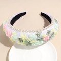 Detail of floral embroidery and white pearls on a wide bohemian padded headband - White
