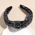 Detail of black knot headband with silver spider web print for Halloween party - Spider Web Black