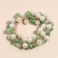 Detail view of woven elastic hair tie with green crystal beads and white faux pearls - Green