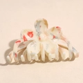 Dettaglio molletta per capelli a fiore con motivi natalizi e finitura color crema - Fiore Decorativo Rosso-Verde