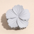 Top view of matte light blue flower hair claw clip with detailed petal texture - Gray