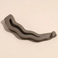 Detailed close-up of olive green matte wave banana hair clip with internal teeth - Brown