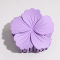 Macro detail of purple matte flower hair claw clip with delicate petal texture and grip teeth - Purple