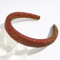 Detail eines gepolsterten Weihnachts-Haarreifens mit rot-grünen Glitzerstreifen - Flacher Stil / Flaches Rot