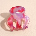 Macro detail of pink and purple acetate hair claw with marble texture and pearly luster - Pink Purple