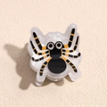 Close-up of spider hair claw with black and yellow stripes for Halloween hair accessory - Spider