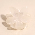 Detail view of the inner spring mechanism and model marking on a cream flower hair claw - Jelly Cream White
