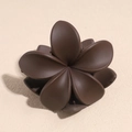 Detail view of a matte chocolate brown flower hair claw clip on a beige textured background - Matte Dark Brown