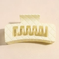 Detail view of large cream square hair claw clip with quilted texture and matte finish - Off White