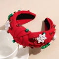 Détail d'un serre-tête de Noël rouge avec nœud, perles et breloques flocon de neige - Bonhomme de Neige Flocon Rouge